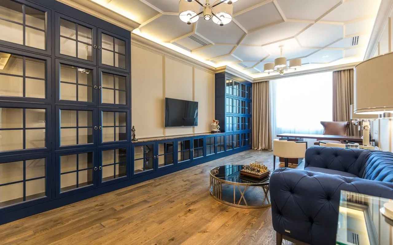 Luxury hotel room interior with blue sofa and wooden floor for hotel booking services